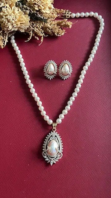 Gold-tone pearl pendant set from Hema Collections