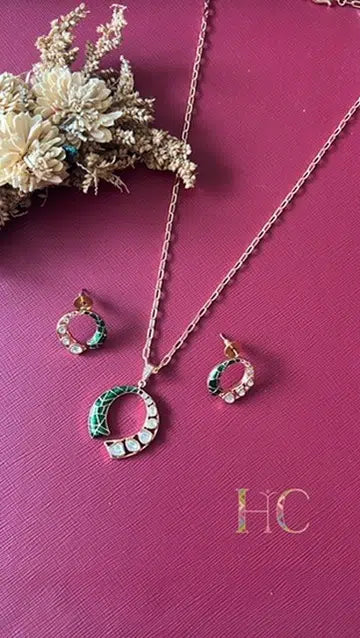 Gold-tone green pendant set from Hema Collections