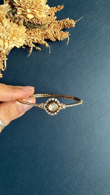 Close view of the white Kundan stonework on the Hafsa matt gold bangle
