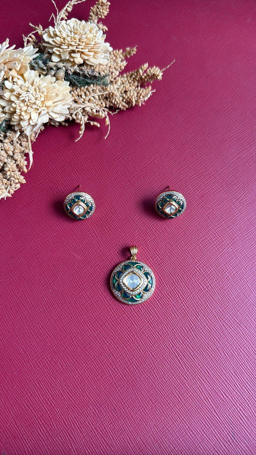Gold-tone sea green Kundan pendant set from Hema Collections