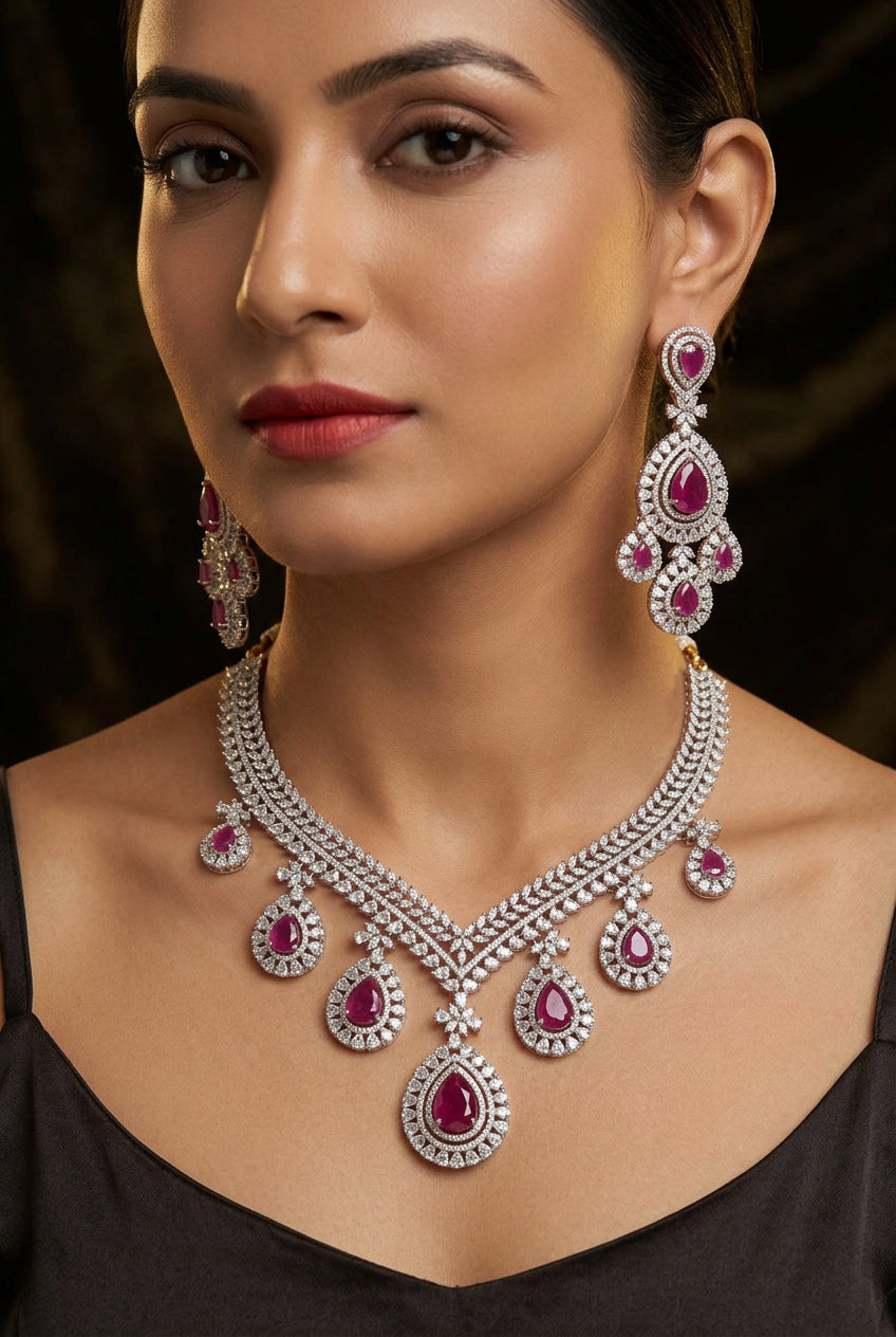 Supriya ruby-pink American Diamond necklace set with chandelier earrings