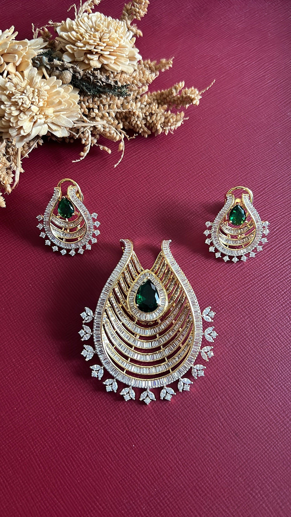 Gold-tone green American Diamond pendant set from Hema Collections