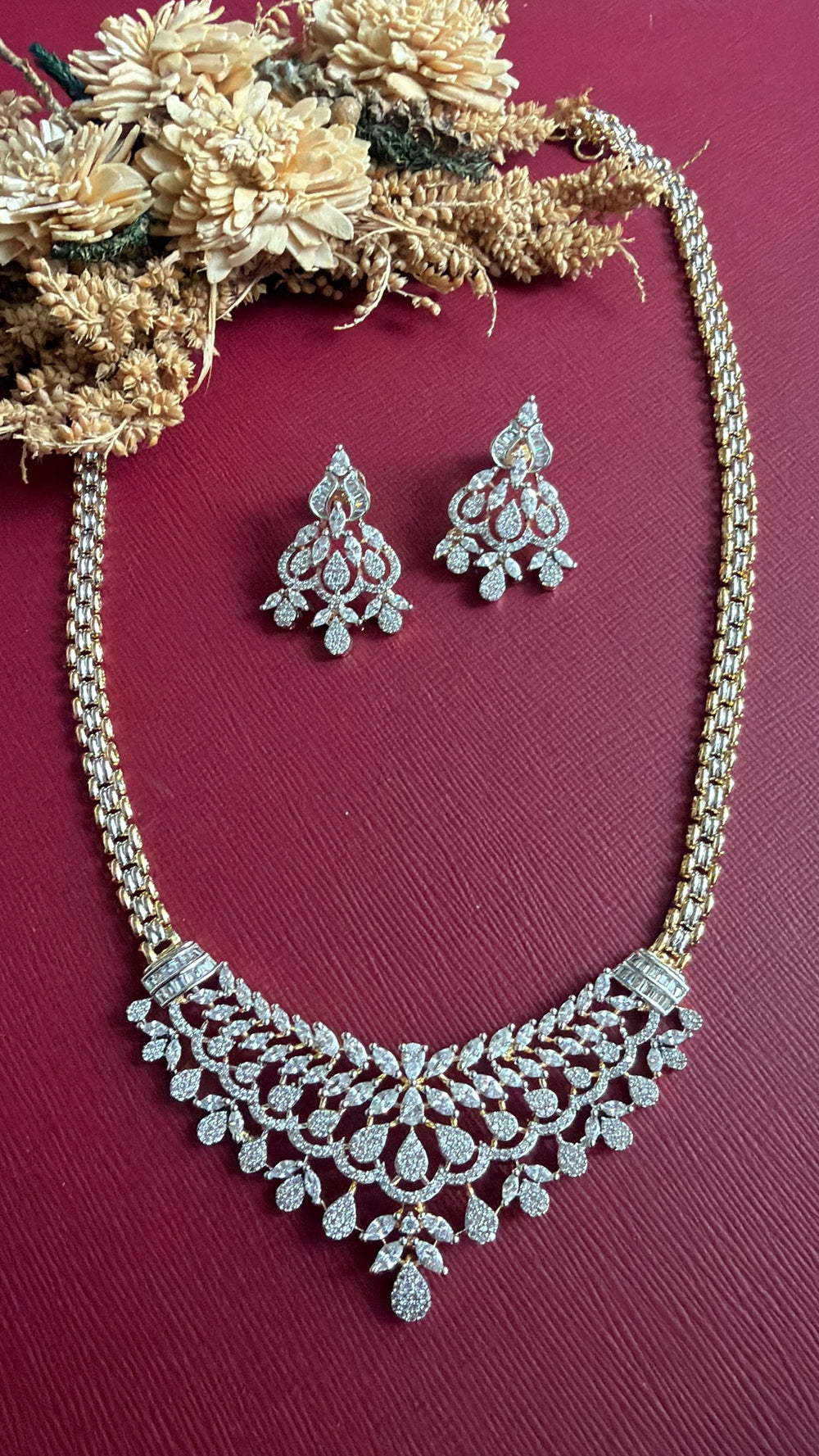 Khristy dual-tone American Diamond necklace with lace-like V front and link chain