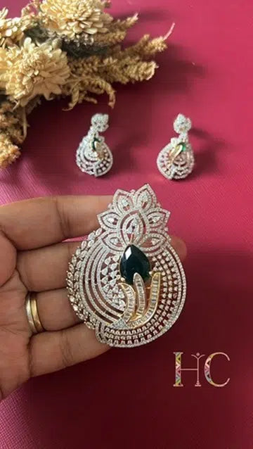 Gold-tone green American Diamond pendant set from Hema Collections