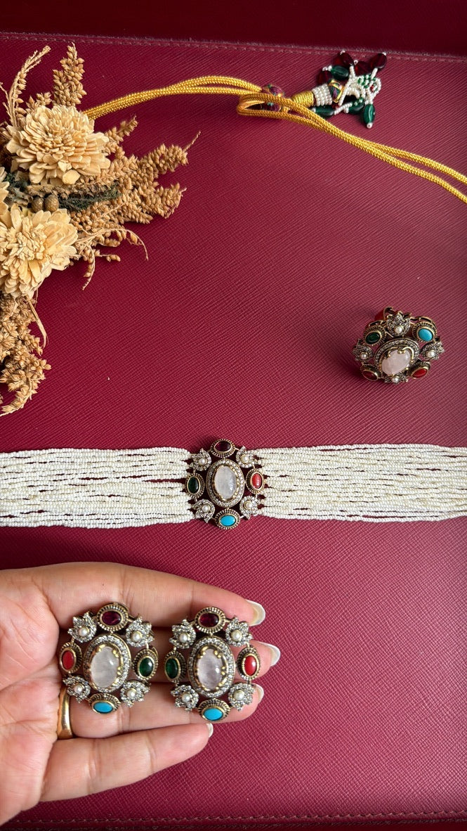 Swatika Victorian multi choker set: pearl-look bead strands, rose-quartz-look centre with multi-colour stones, gold dori tie, adjustable ring, and studs held in hand