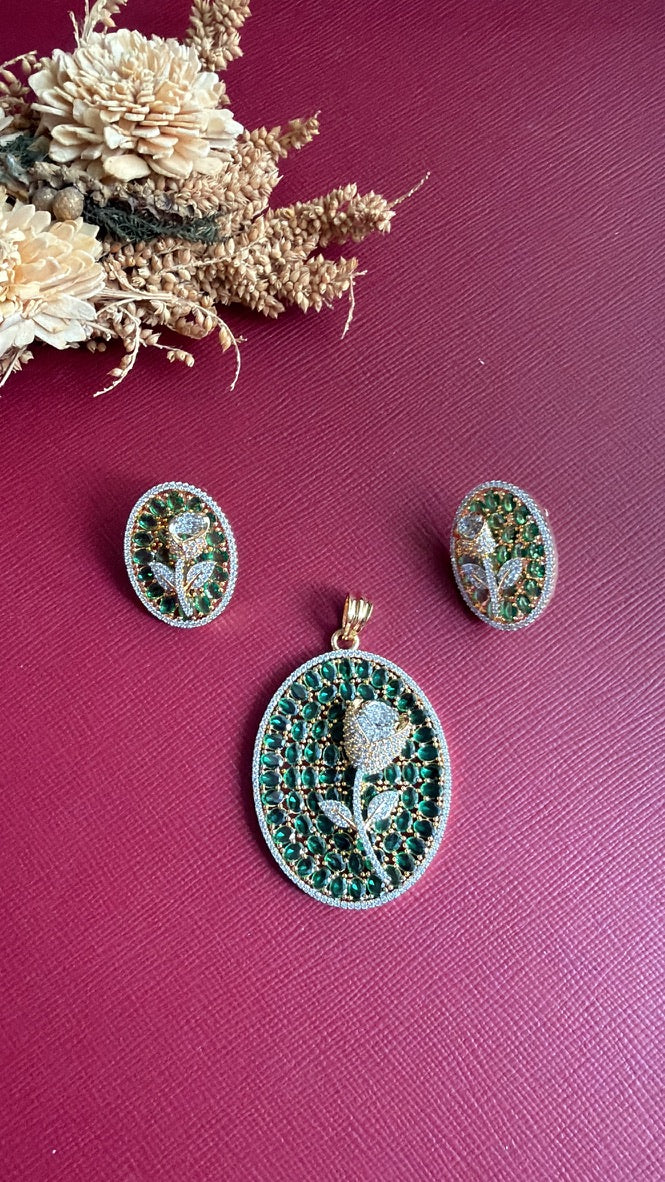 Nirali green stone rose pendant with white CZ border on a gold-toned setting, and oval rose stud earrings