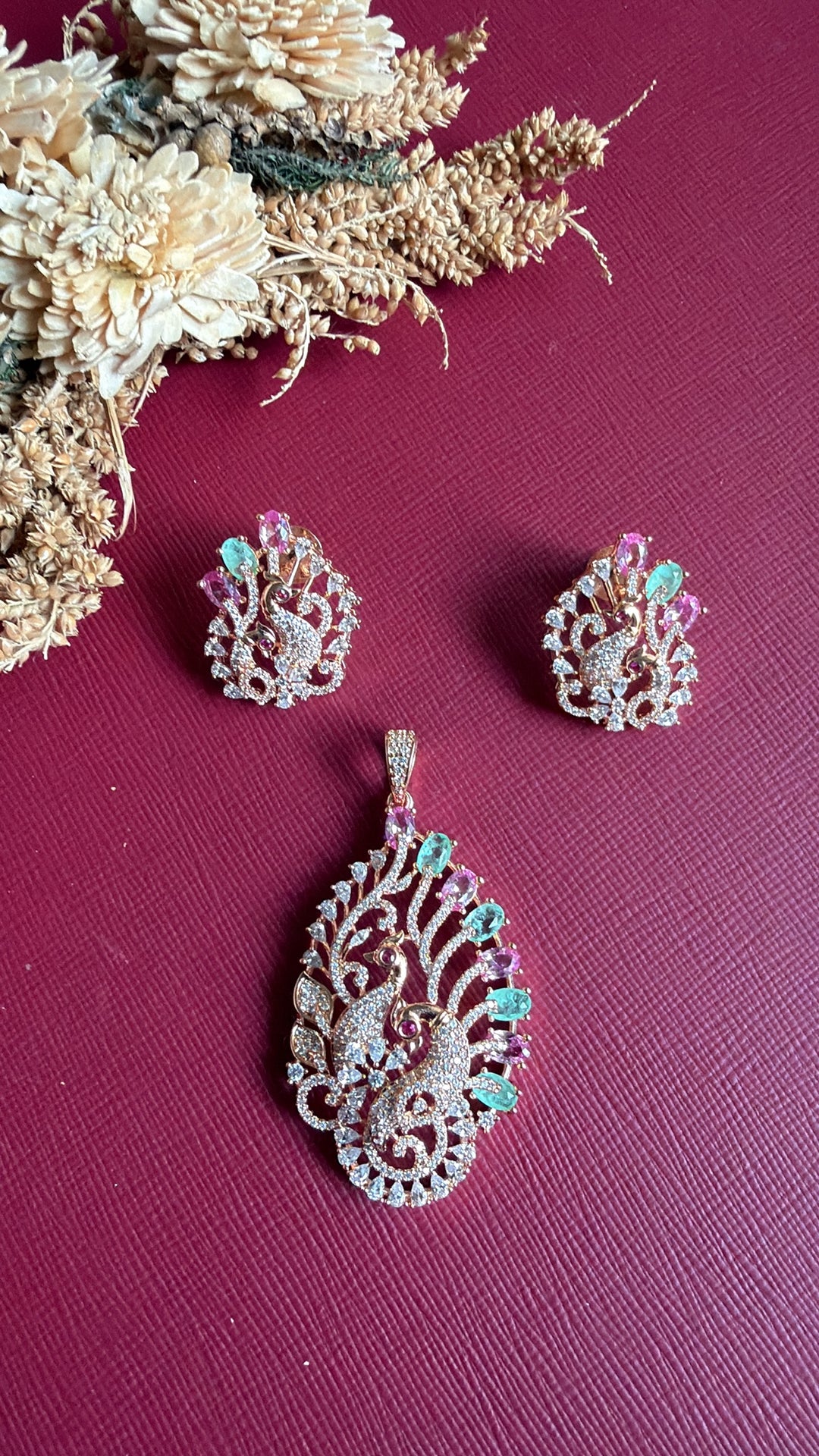 Emaan rose gold American Diamond peacock pendant set flat lay