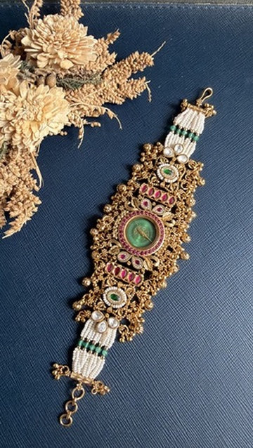 Kundan and pearl detailing on gold-tone ethnic watch bracelet