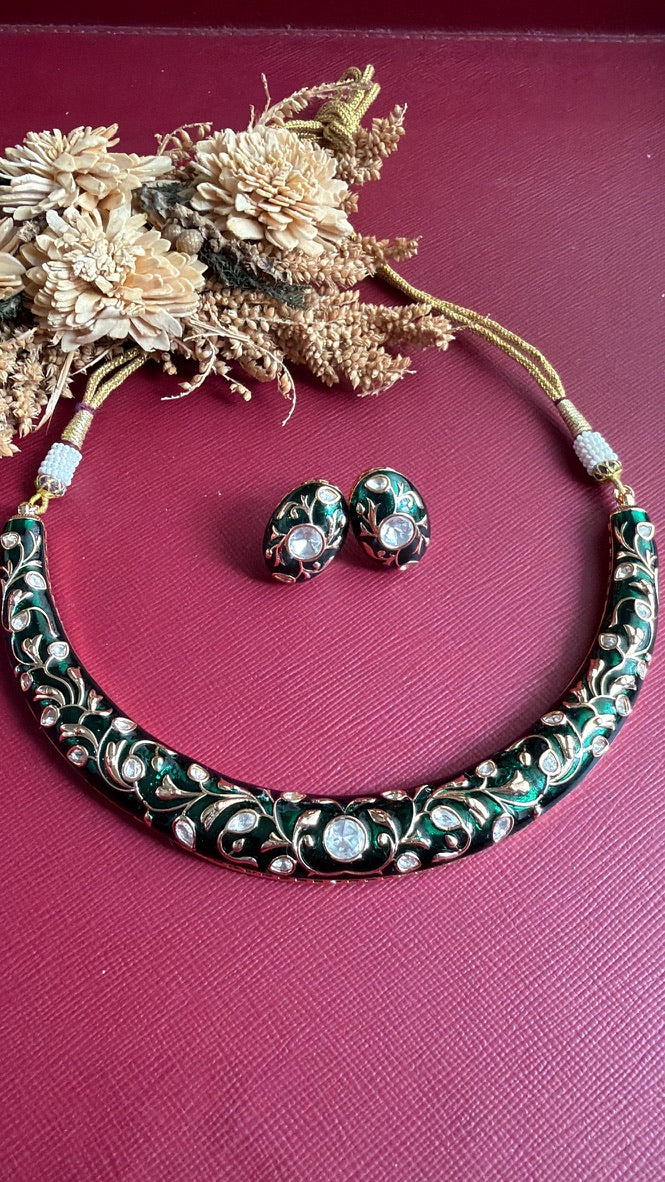 Anushree green meenakari hasli and studs flat lay