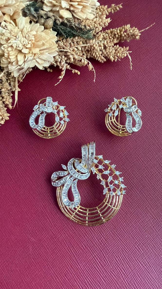 Aisha pendant set shown in full with its chain and matching earrings