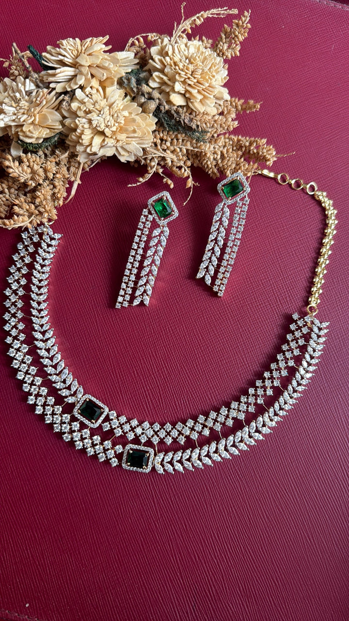 Vedika green stone layered necklace set with 2.25-inch fringe earrings, flat lay