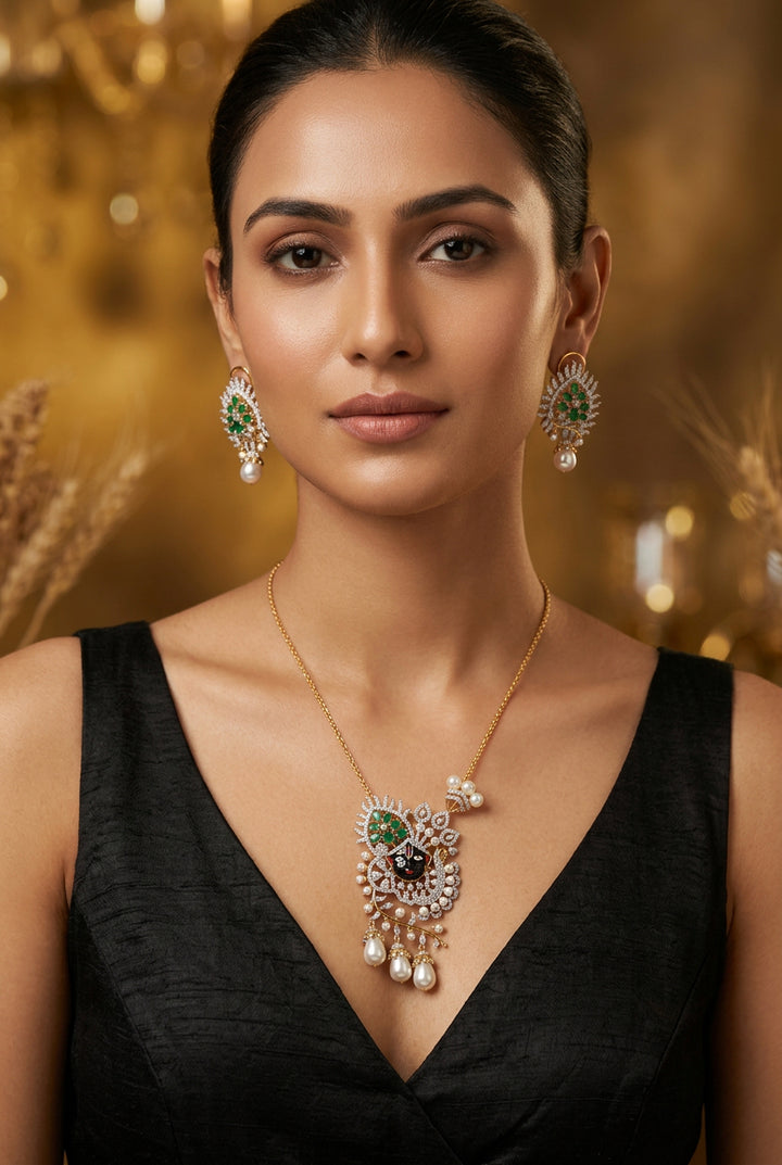 Krishika Shrinathji face pendant set with American Diamond, green stones and pearl-look drops