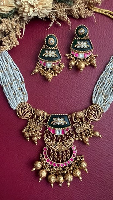 Close-up of the hand-set Pachi Kundan work and green stones on the Ruhinka choker