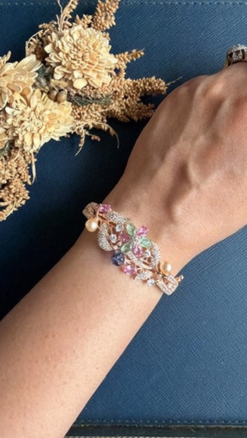 Chellan rose gold floral bracelet worn on the wrist