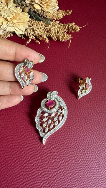 Close view of the baguette-cut stones and ruby-pink oval on the Aahana pendant