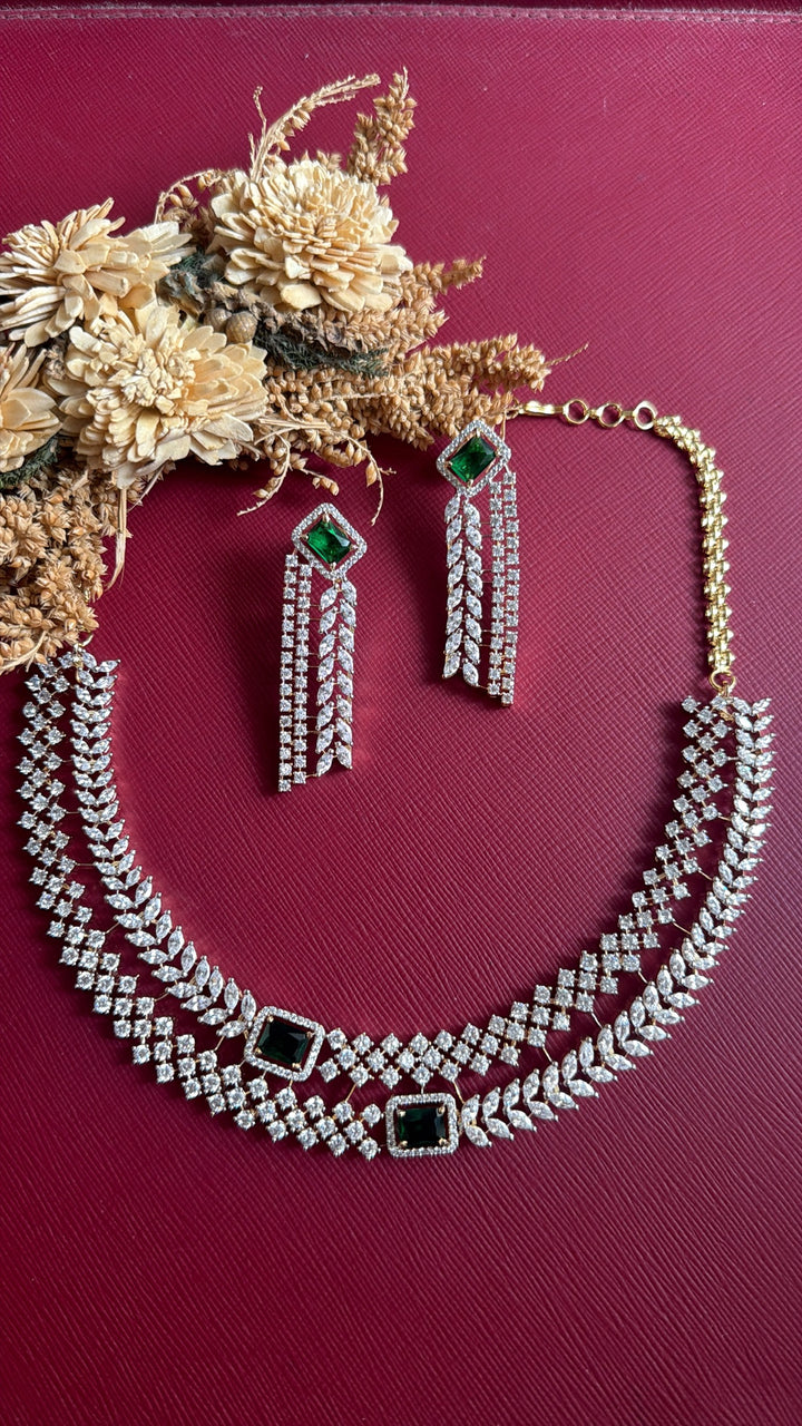Vedika dual-tone layered necklace with two emerald-green stones and matching fringe earrings