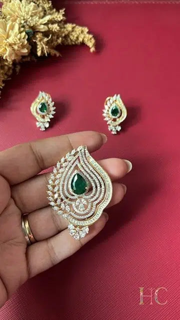 Gold-tone green American Diamond pendant set from Hema Collections