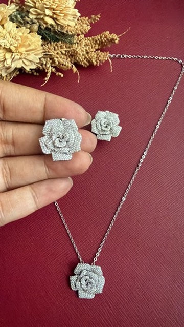 Close view of the Roosy American Diamond rose pendant set in silver-toned finish