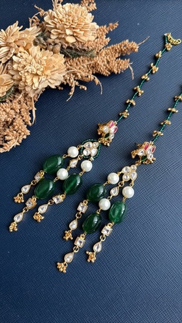Pair of Madhuri emerald green Kundan earrings with attached beaded ear chains and pearl beads