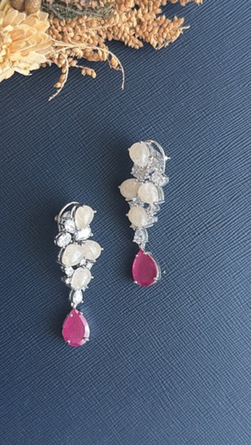 Suri milky-white doublet and American Diamond earrings with ruby-pink teardrop