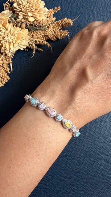 Multicolour cushion-cut American Diamond tennis bracelet in a silver-tone finish