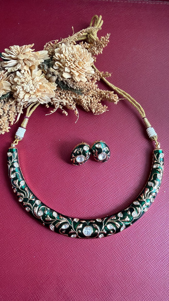 Anushree green meena hasli with gold-toned floral vine and Kundan-style stones