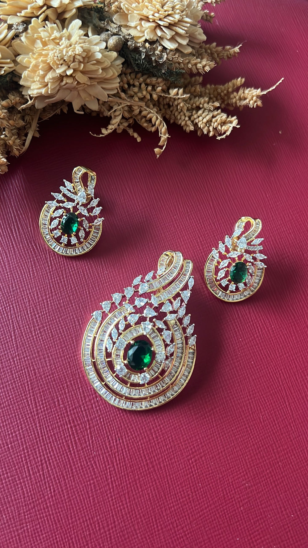 Gold-tone green American Diamond pendant set from Hema Collections