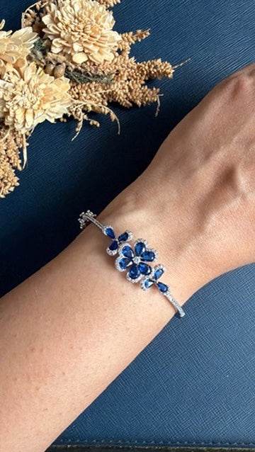 Rania Diamond Bracelet worn on the wrist – royal blue flower motif with American Diamond in silver finish