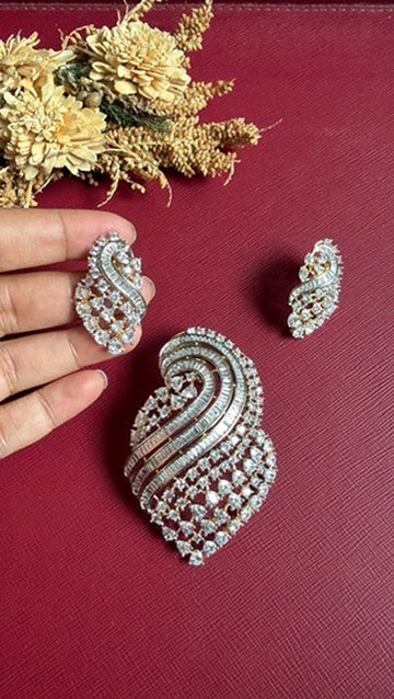Matching screw-lock earrings from the Rubal diamond pendant set