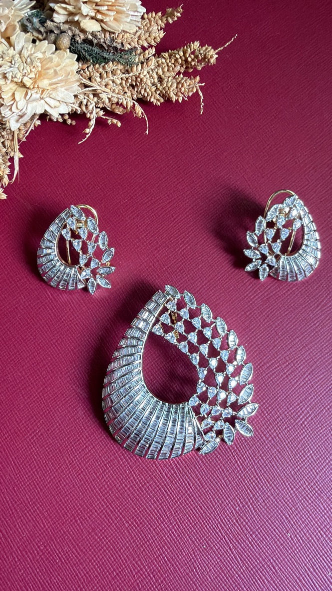 Ayesha bucket diamond pendant and matching earrings in two-tone gold and silver, shown from above