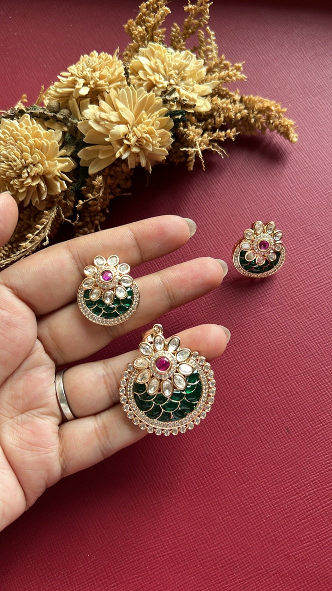 Gold-tone green Kundan pendant set from Hema Collections