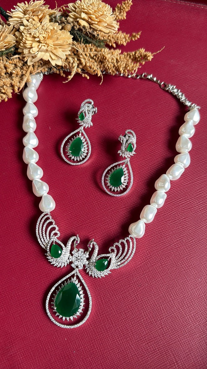 Babira green pearl and diamond necklace set shown with its matching earrings