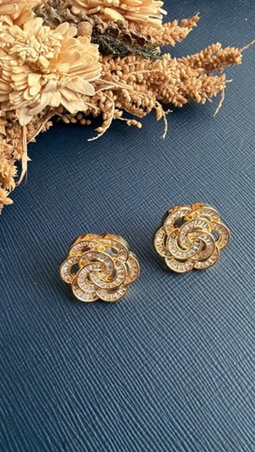 Damini swirl-rose stud earrings with baguette-cut white American Diamond on a gold-toned setting