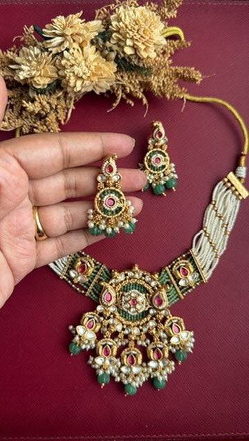 Green and white kundan-style necklace set for weddings and festive wear