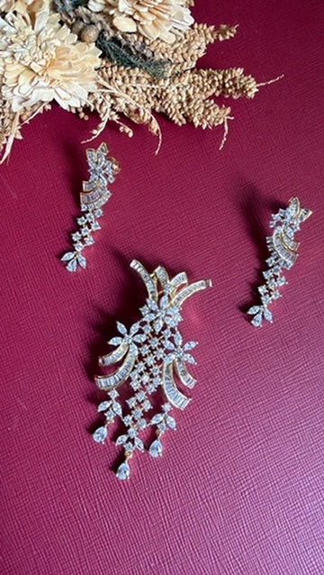 Sufiyana white American Diamond pendant and drop earrings, angled view