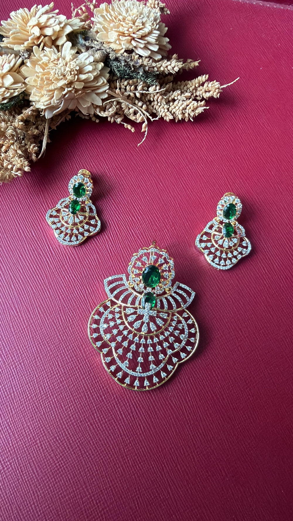Gold-tone green American Diamond pendant set from Hema Collections