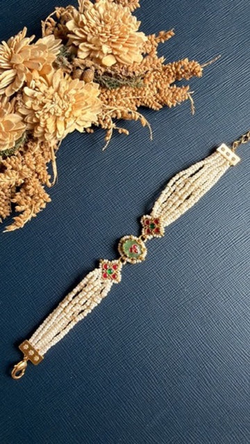 Traditional Pachi Kundan stonework on gold-tone bracelet