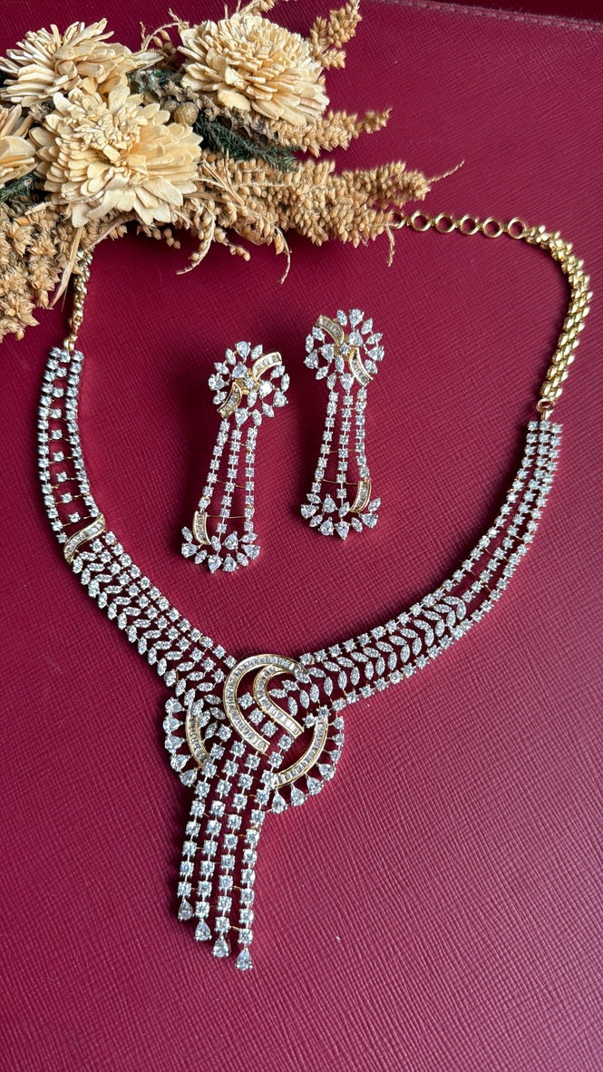Dual-tone Farida American Diamond necklace and earrings with baguette and pear-shaped CZ stones