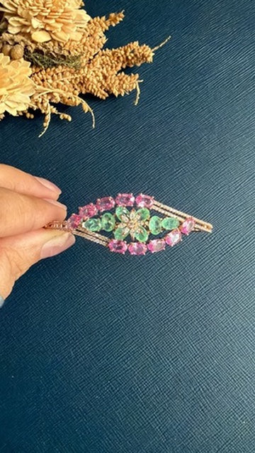 Close view of the multicolour stones and CZ on the Nuriyan gold-tone bangle