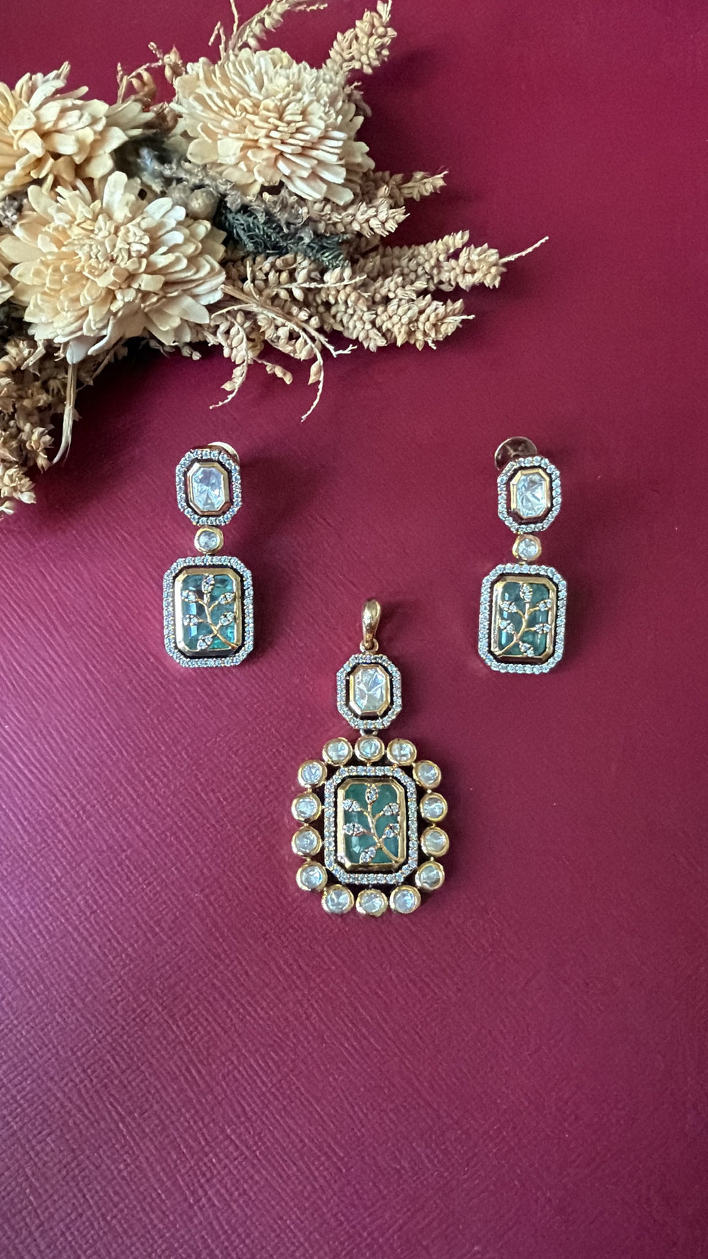 Gold-tone sea green Kundan pendant set from Hema Collections