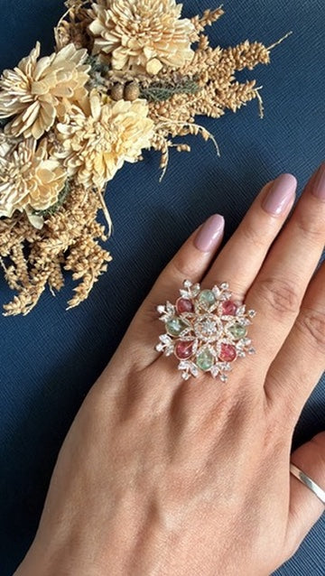 Eashea rose gold-toned cocktail ring with pink and mint-green stones, worn on hand