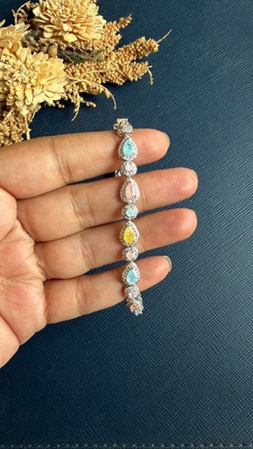 Malak multicolour tennis bracelet worn on the wrist, silver-tone rhodium finish