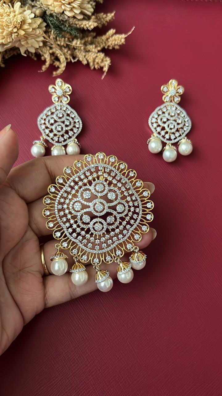 Gold-tone CZ pendant set with pearl-style drops and matching earrings